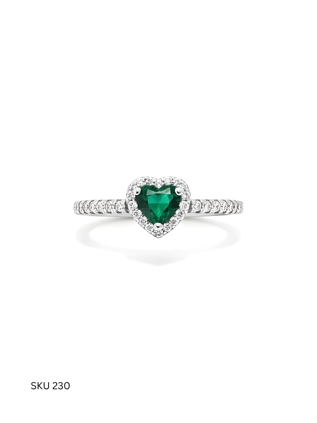 Heart-shaped emerald ring with diamond accents on a white background