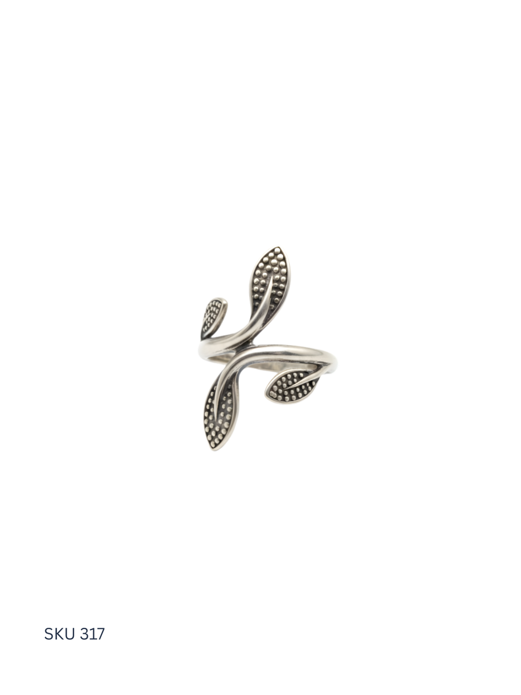Silver leaf-shaped ring on a white background
