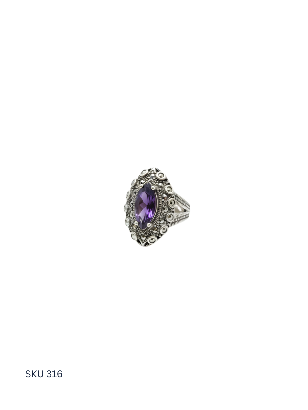 Silver ring with a purple gemstone on a white background