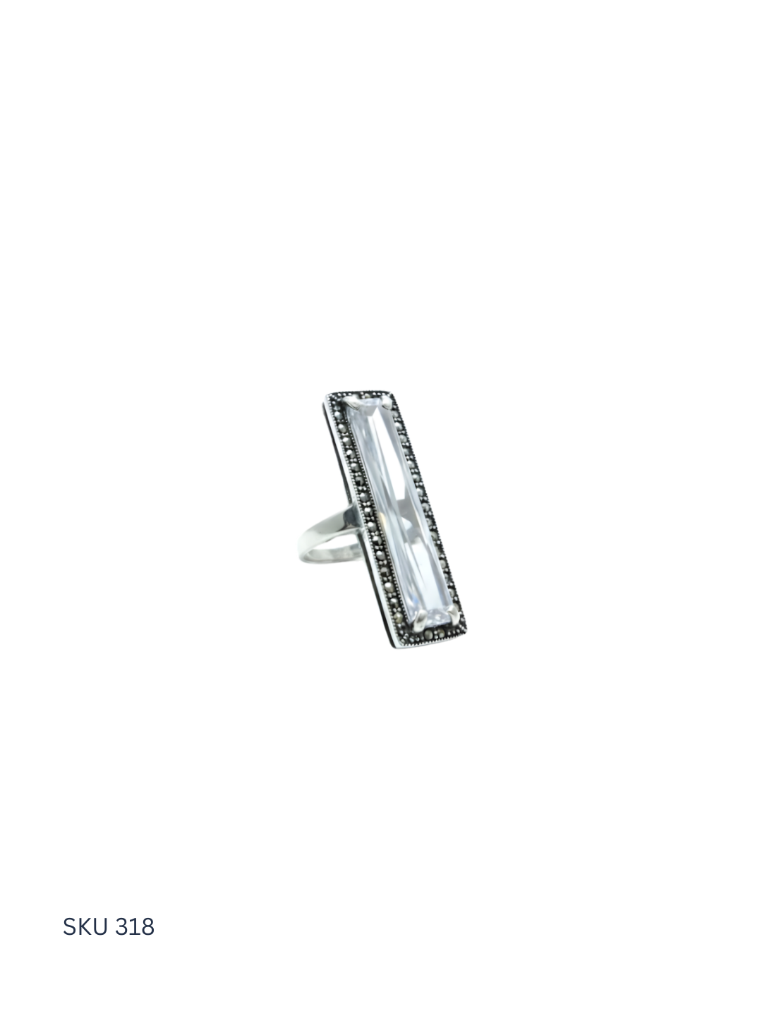 Silver ring with a rectangular gemstone on a white background