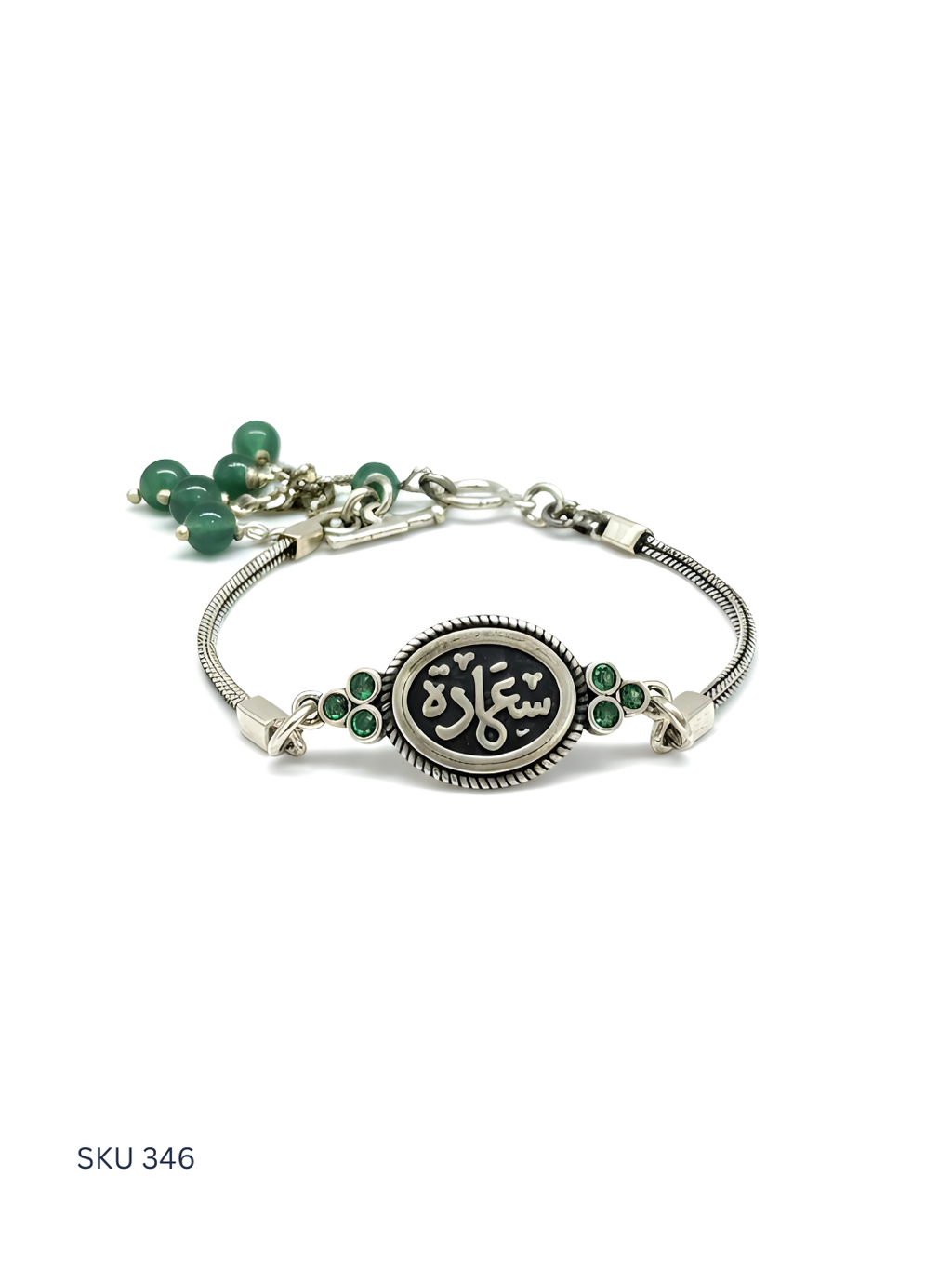 Silver bracelet with green beads on a white background