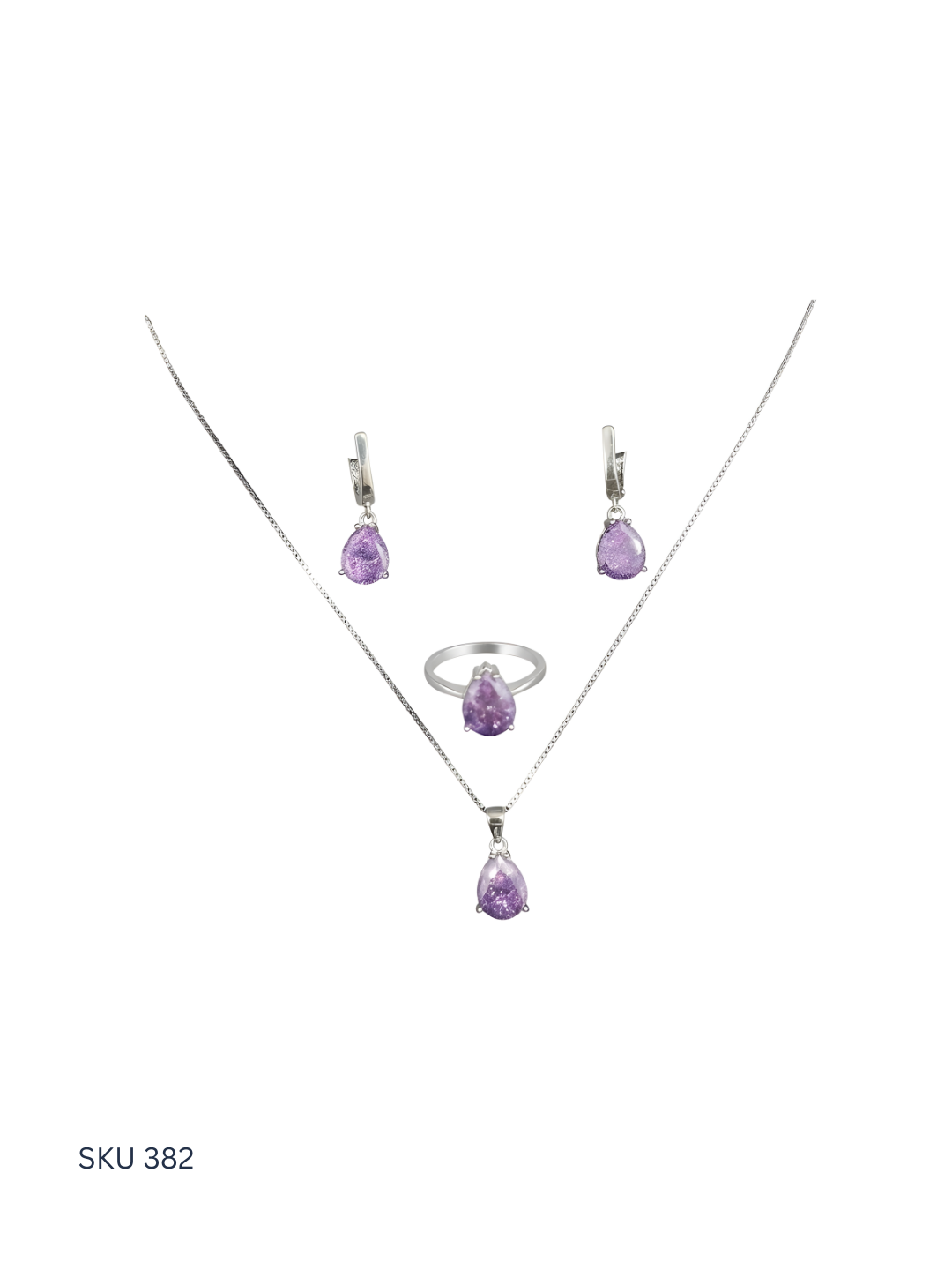 Jewelry set with purple gemstones on a white background