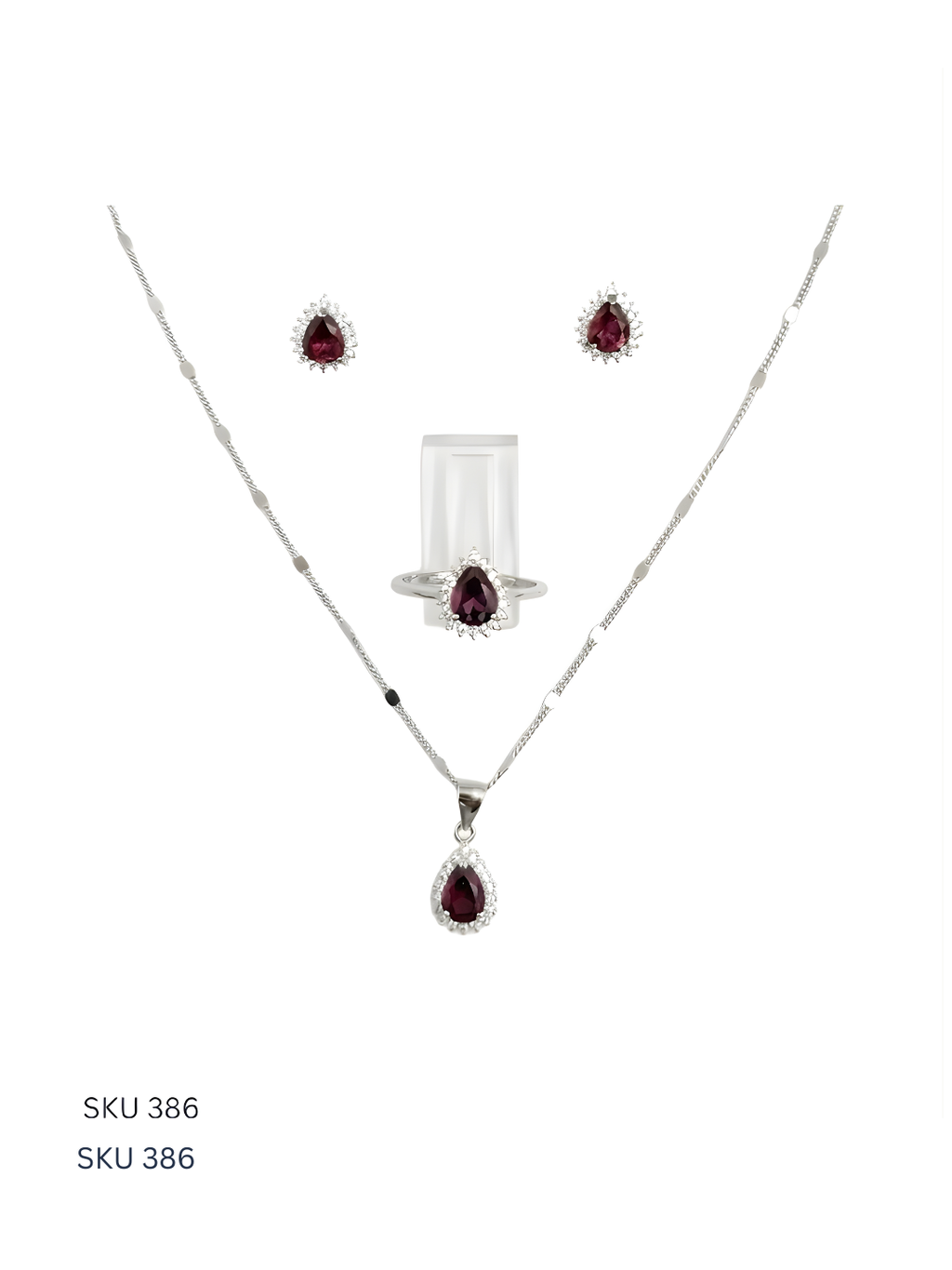 Jewelry set with necklace and earrings featuring red gemstones on a white background.