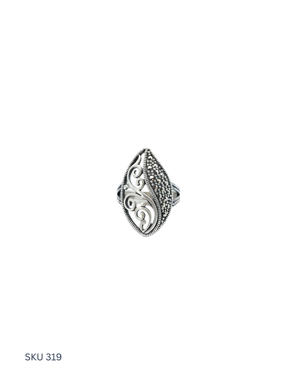 Silver ring with intricate design on a white background