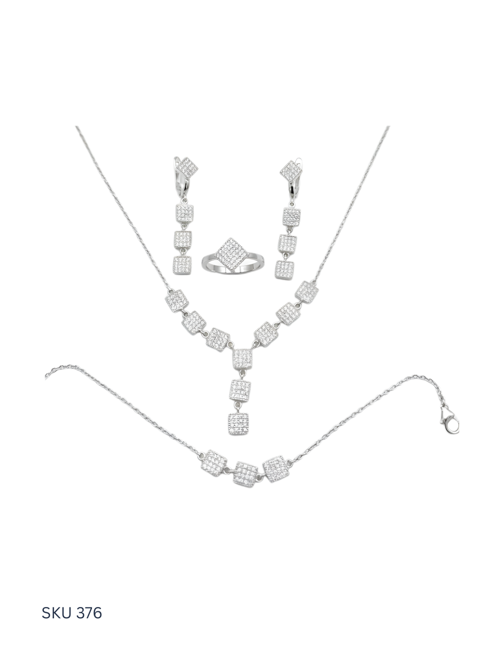 Silver jewelry set with necklace, bracelet, and ring on a white background