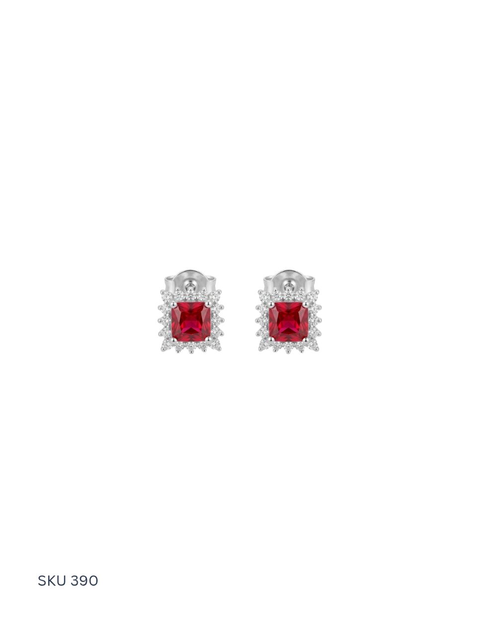 Pair of earrings with red gemstones on a white background
