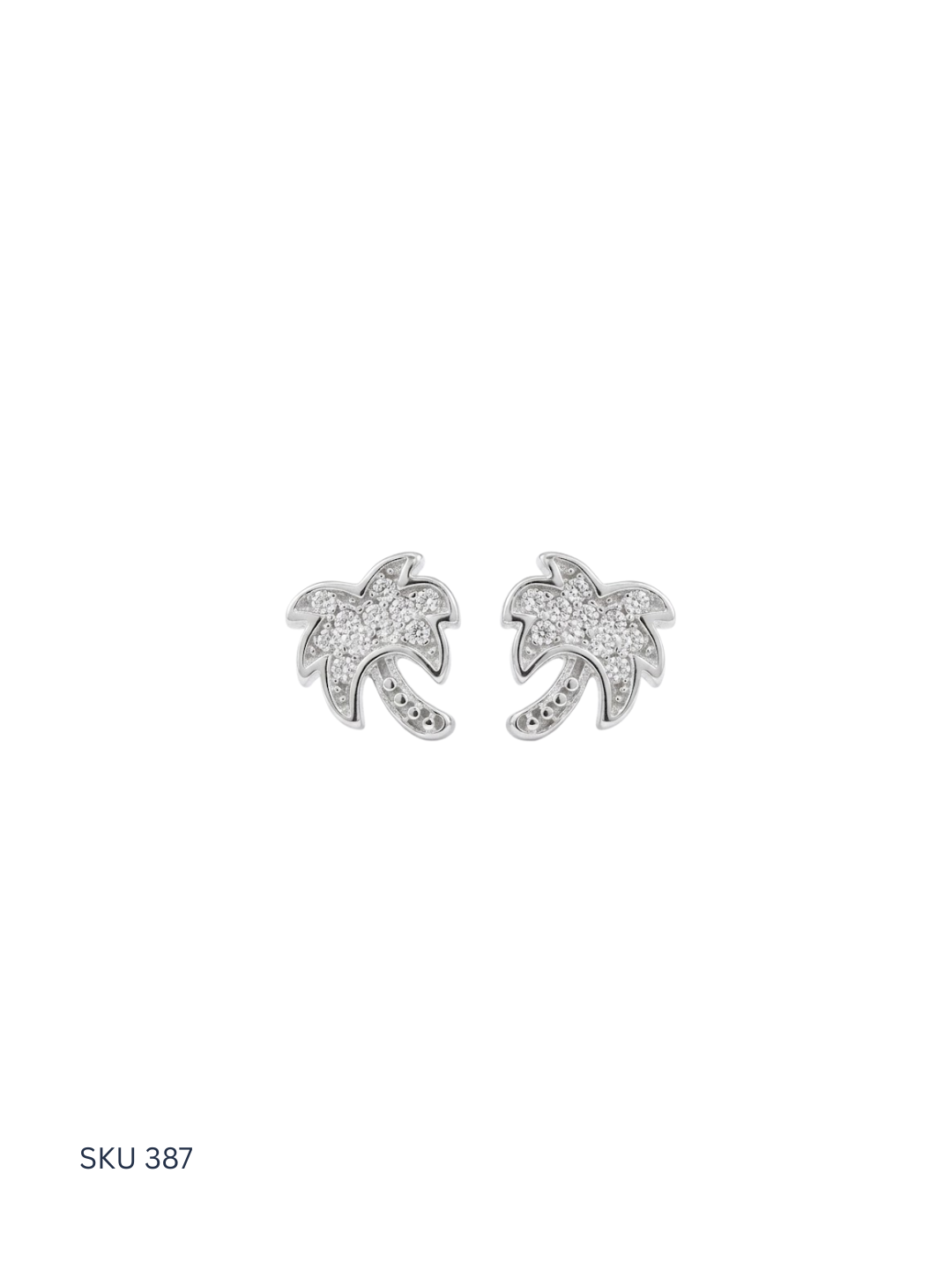 Pair of silver palm tree earrings on a white background