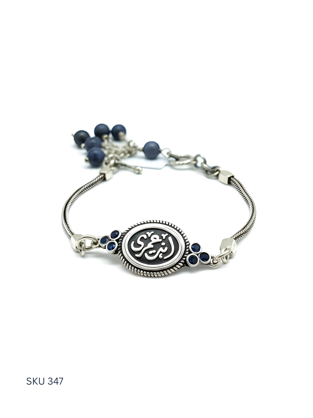 Silver bracelet with blue beads on a white background